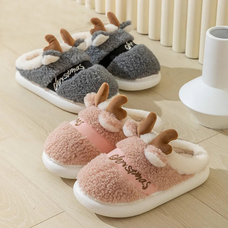Pair of Christmas elk winter home slippers with suede upper, available in candy colours