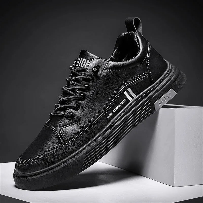 Men's white and black low-top skate shoes with an elastic band and round toe on a rubber sole.
