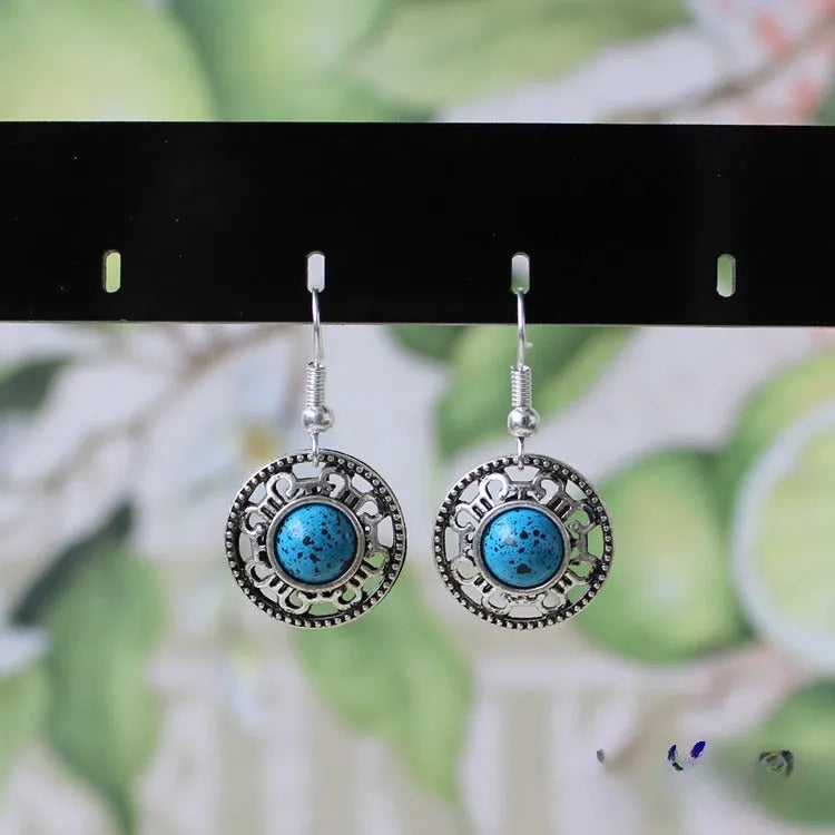 Geometric turquoise flower disk earrings in Miao silver with ethnic patterns