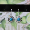 Geometric turquoise flower disk earrings in Miao silver with ethnic patterns