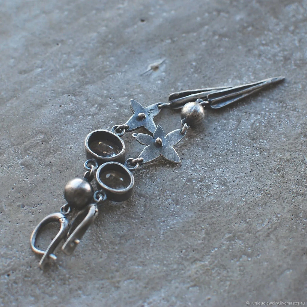 Geometric antique silver earrings with long rhinestone pendants and XINGX design