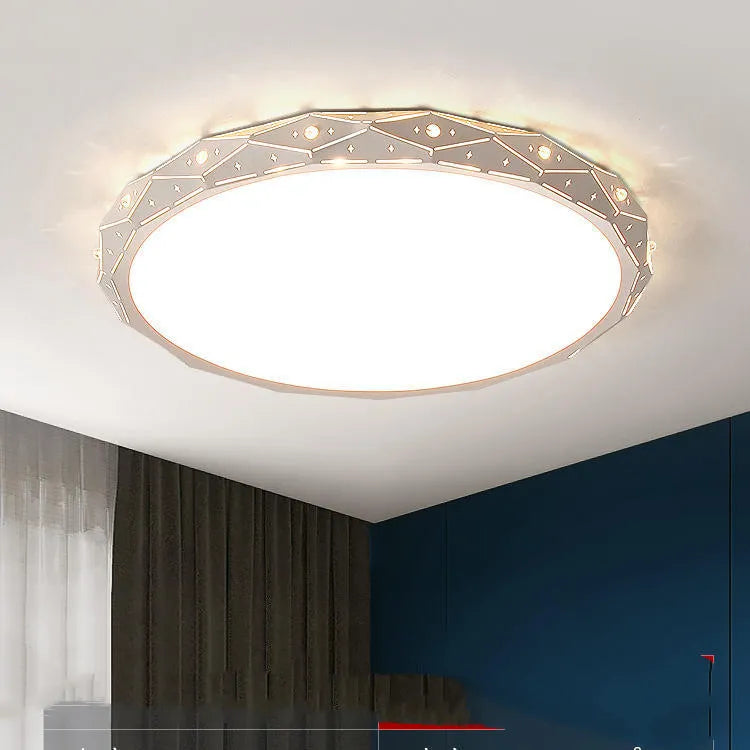 Round black and white framed LED ceiling light fixture for room installation.