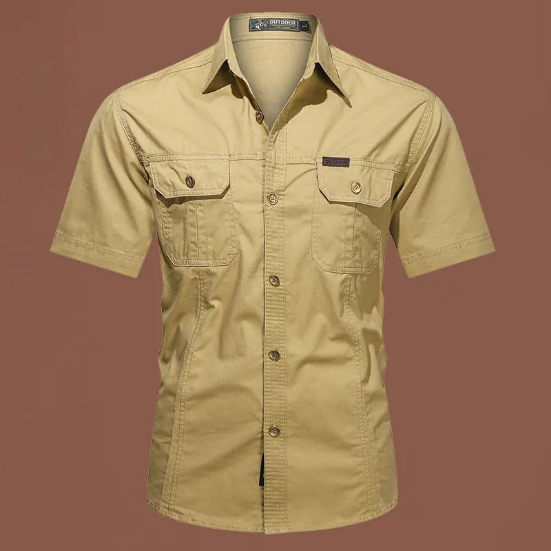 Men's loose-fitting short sleeve cotton work shirt in army green, laid flat.
