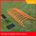 Six foldable yellow, green, and orange hexagon football agility training rings laid out on grass.