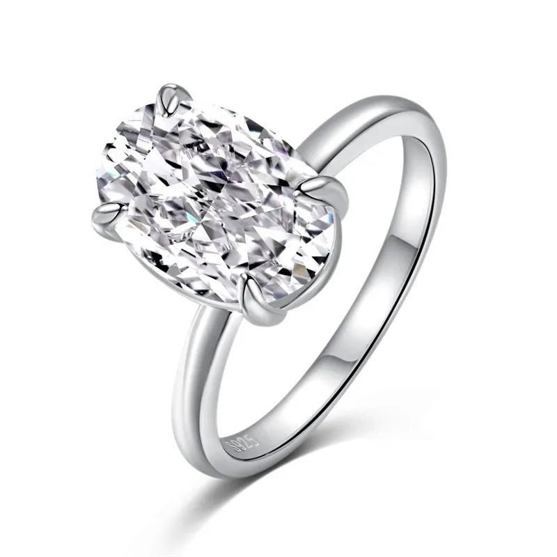 Oval gemstone ring in four-claw setting with 6x9mm stone on finger