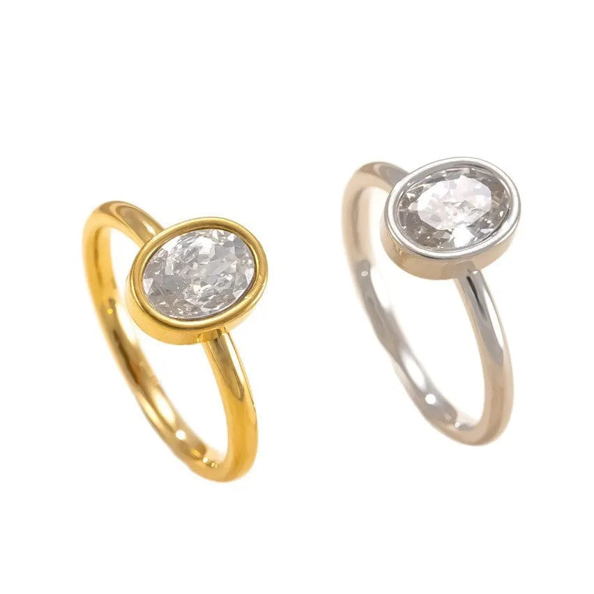 Stainless steel ring with oval zircon stone in geometric shape, unisex, available in steel and gold colours