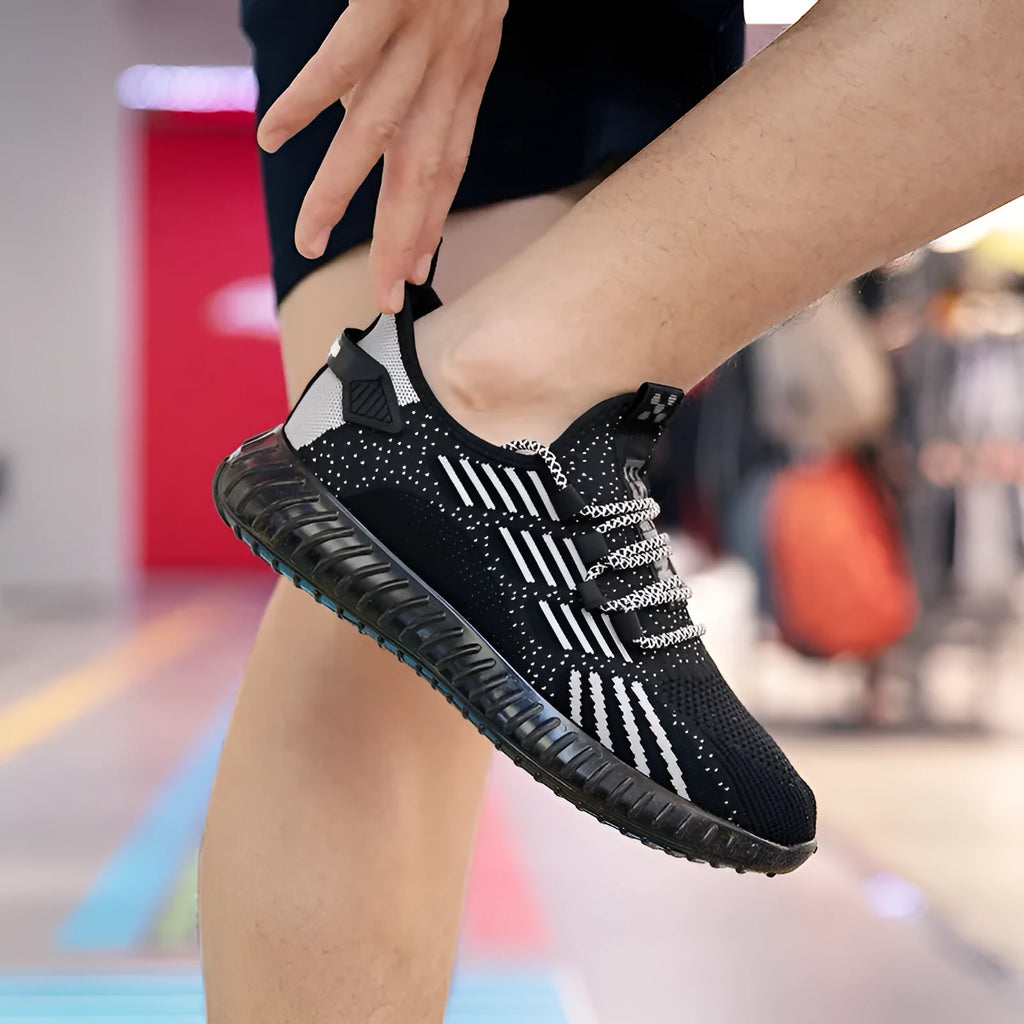 Men's white breathable fabric sports shoes with low-cut design and flat platform heel.
