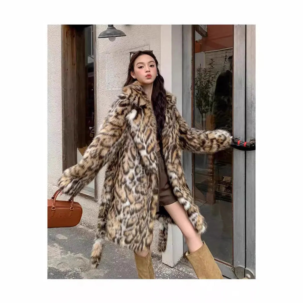 Faux fur coat with fur collar in long or mid-length style showing pocket details