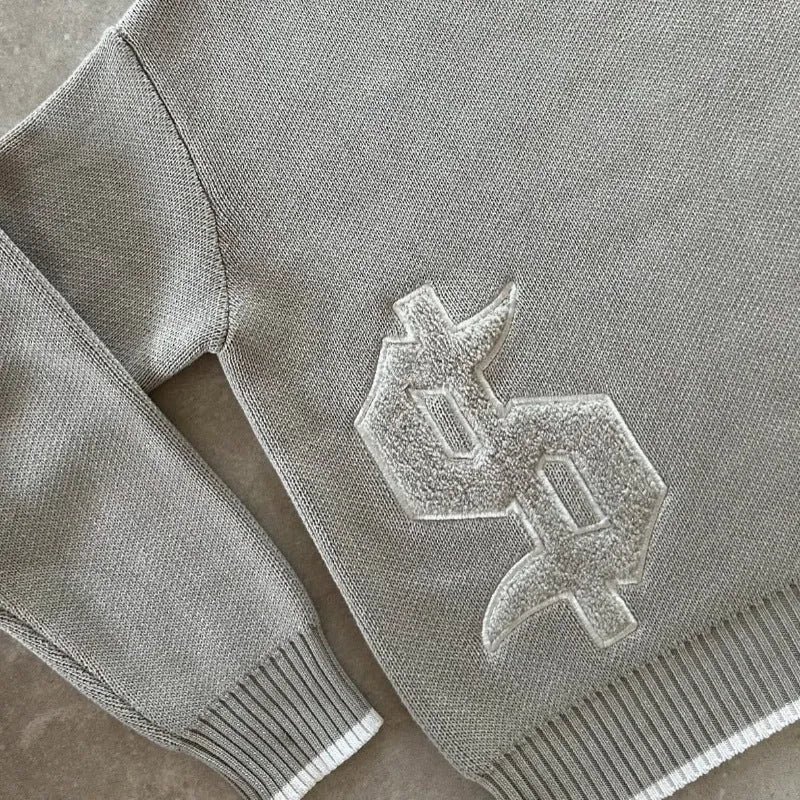 Grey jacquard knitwear coat with loose-fitting pullover style and long sleeves for autumn winter wear
