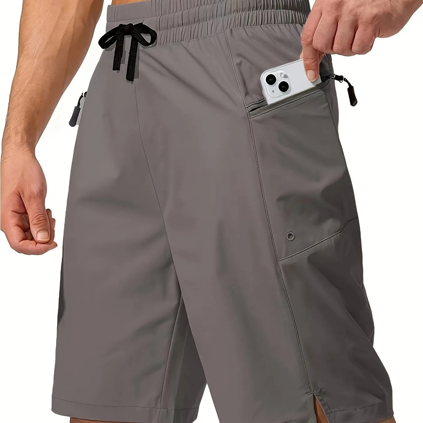 Man wearing solid colour quick-drying polyester beach shorts in a straight leg fit.