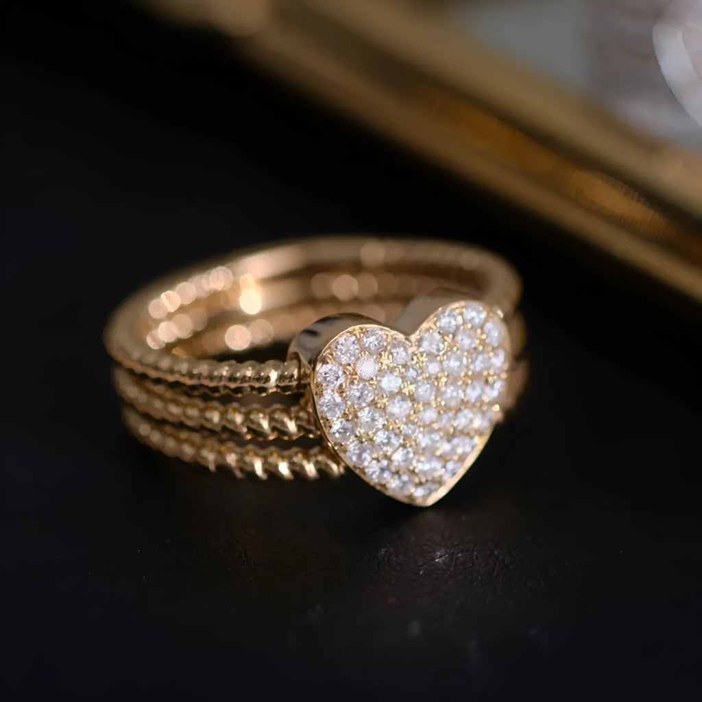 S925 sterling silver ring with heart twist design, available in white gold or yellow gold finish, US sizes 6 to 10