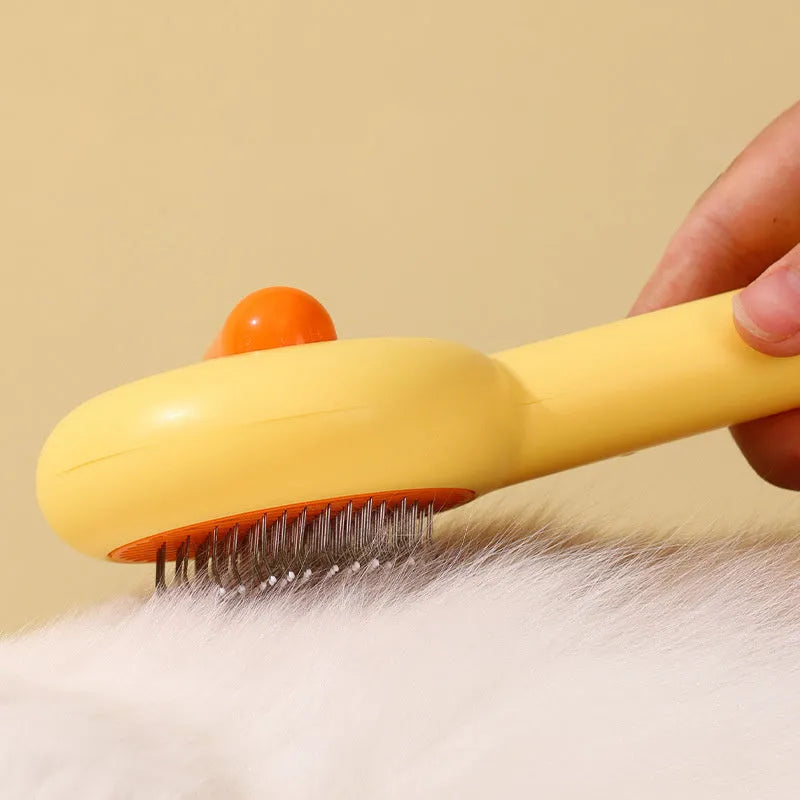 Small yellow plastic comb with needle bristles for pet hair removal on cats and dogs.