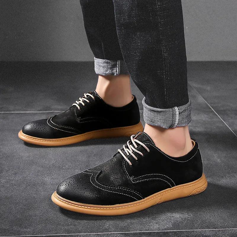 Men's grey low-top leather business shoes with lace-up design and non-slip rubber sole.