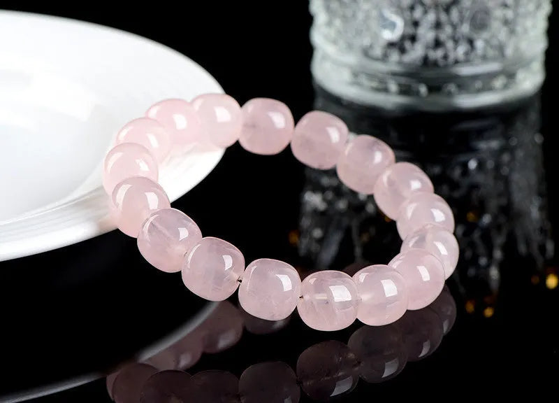 Pink bamboo crystal bracelet with 11-12mm barrel beads and geometric elements