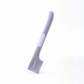 Long-handled pet feeding spoon in green colour with right-angle design for canned food