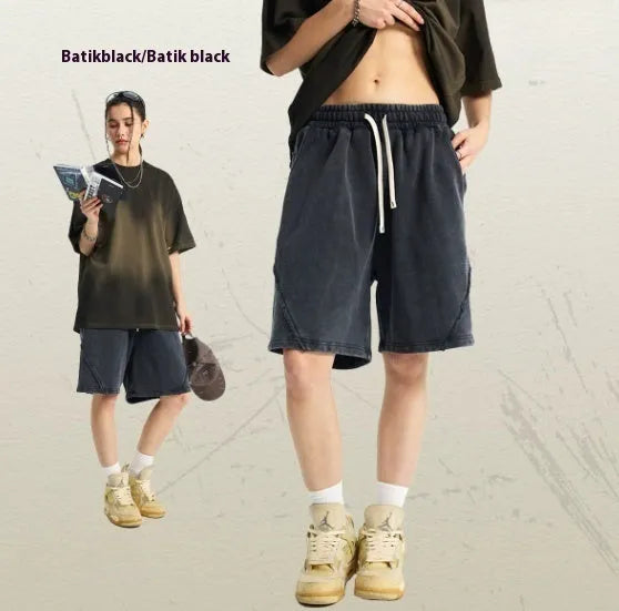 Men's loose-fit pure cotton terry shorts in a batik grey colour, showing street fashion style.