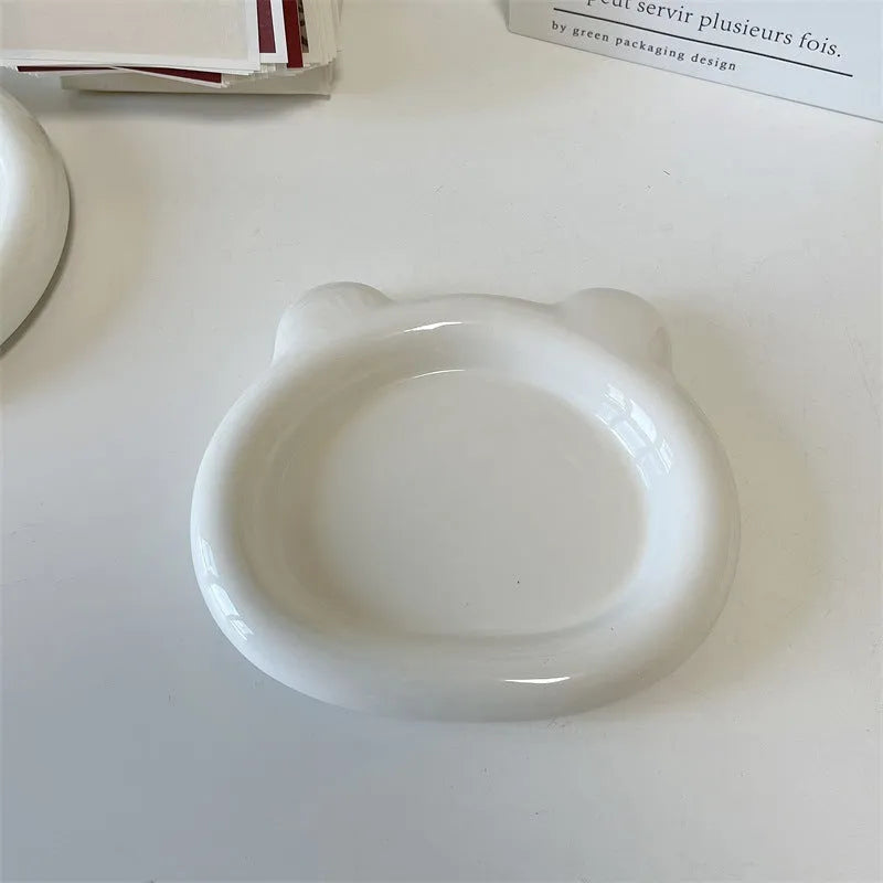 White porcelain chubby toot plate with bear doodle design, suitable for microwave use