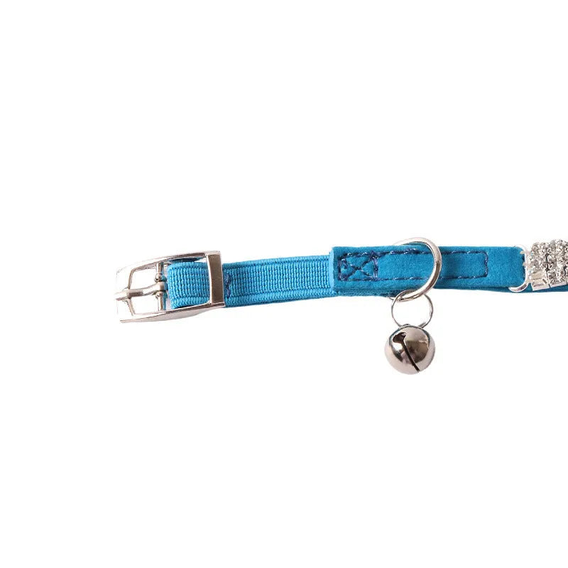 Colourful flocked cat collar with elastic buckle in pink, black, red, blue, purple, and dark brown options.