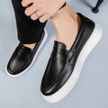 Men's British style casual leather shoes with round toe and slip-on design in artificial PU material