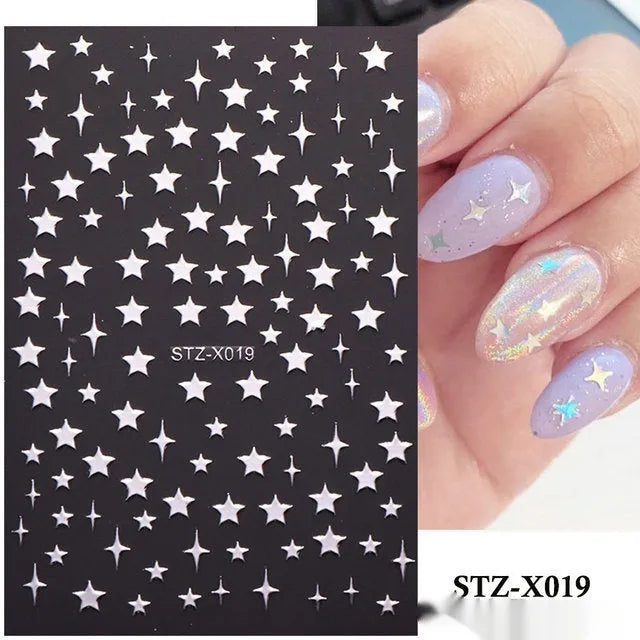 Sheet of black and silver love heart pattern nail art stickers with a plastic nail patch.
