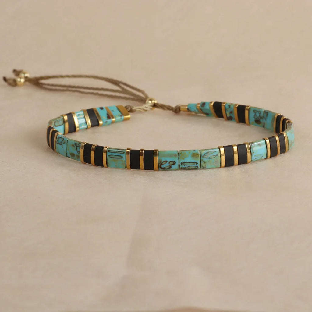 Geometric glass and coloured glaze bead bracelet in milky white, black, green, blue, or red