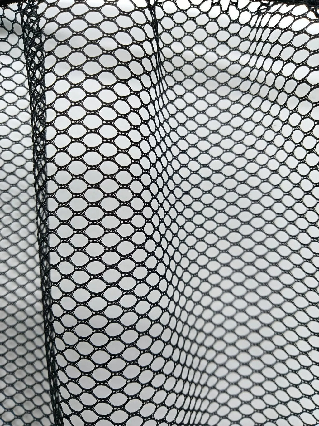 Polyester elastic storage net for car boot organisation in two size options.