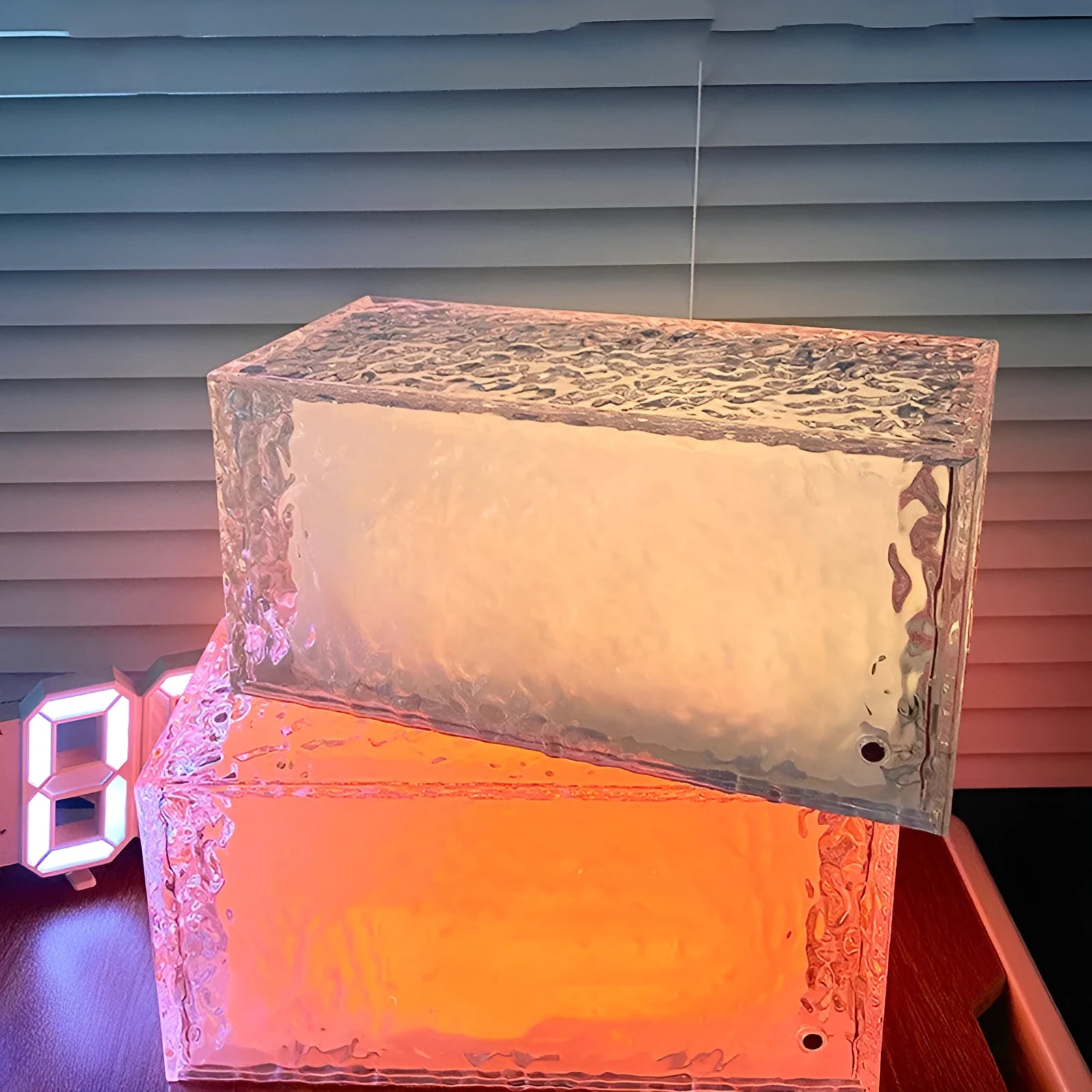 Acrylic ice cube geometric night lamp with colour changing light on bedside table