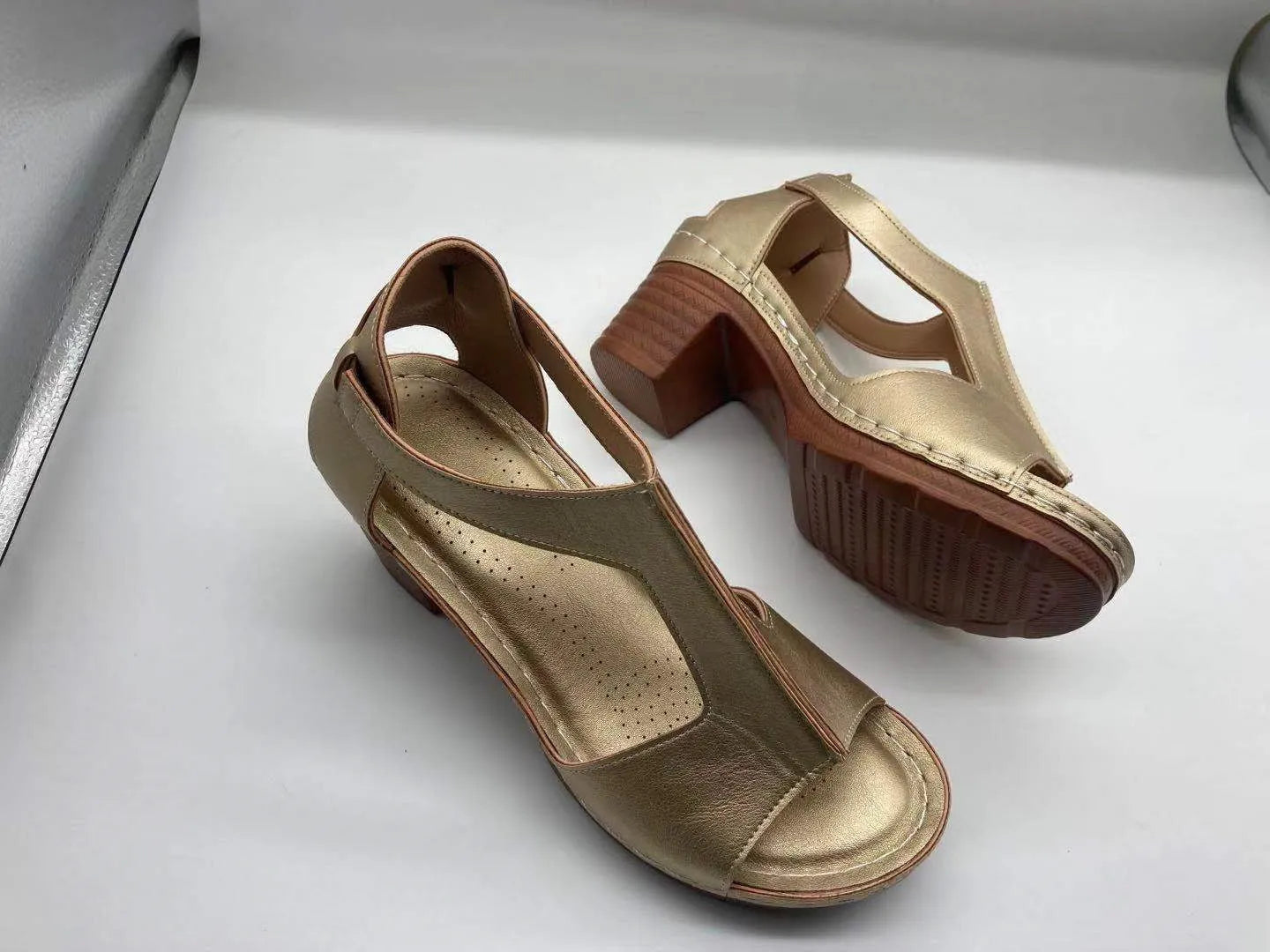 Plus size women's wedge sandals with peep toe, Roman buckle detail, and fish mouth design
