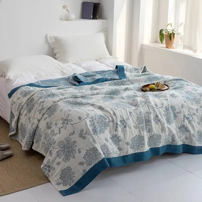 Pure cotton five-layer gauze bed blanket in modern simplicity style, shown in blue roulette wheel pattern.