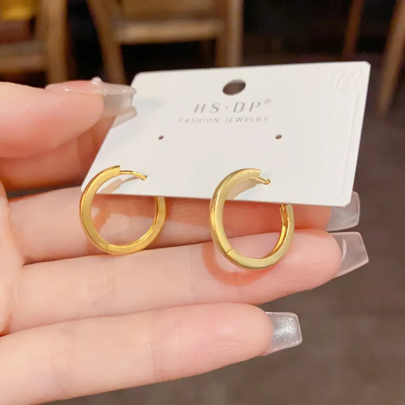 Circular geometric copper ear clips for women with gold or silver finish