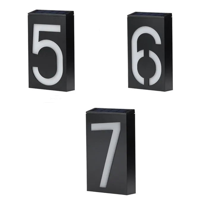 Solar powered white LED house number light mounted on a wall with IP65 waterproof rating