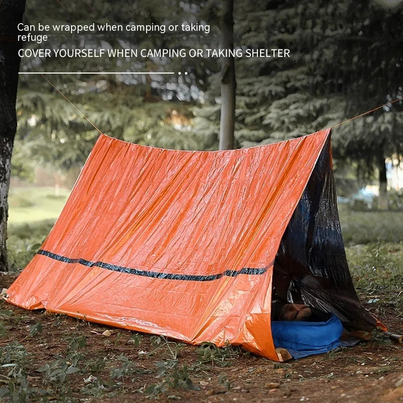 Portable orange emergency tent with sleeping bag and whistle for disaster relief camping