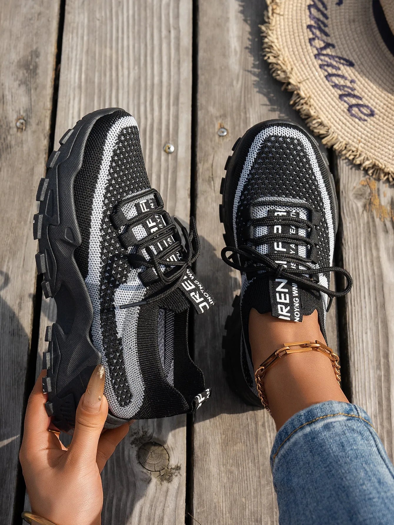 Women's Flyknit mesh lace-up sneakers in grey and white colourway