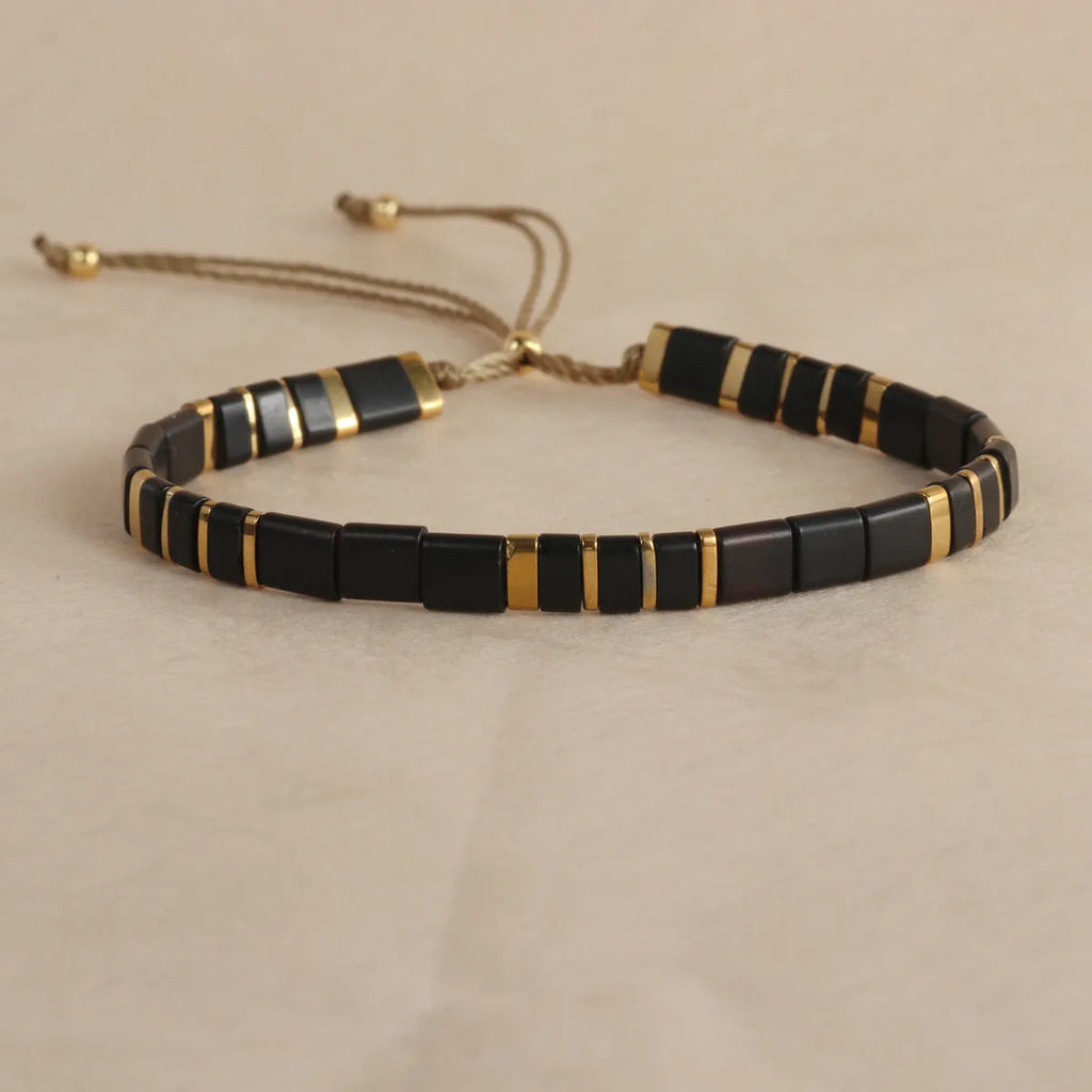 Geometric glass and coloured glaze bead bracelet in milky white, black, green, blue, or red