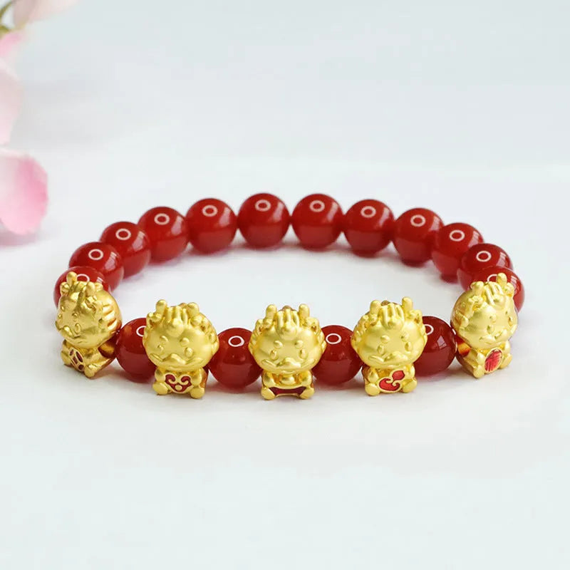 Close-up of 8mm red agate bracelet with carved Five Blessings Dragon design on wrist.
