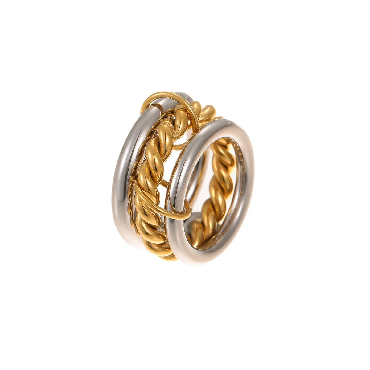 Stacked gold plated stainless steel ring set showing exaggerated design on a model's hand.