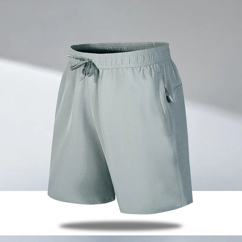 Men's loose fit quick-drying sports shorts in polyester fabric for summer activities