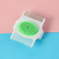 Multifunctional pet comb in blue or green for dog hair removal and massage, measuring 8.5cm x 7.5cm