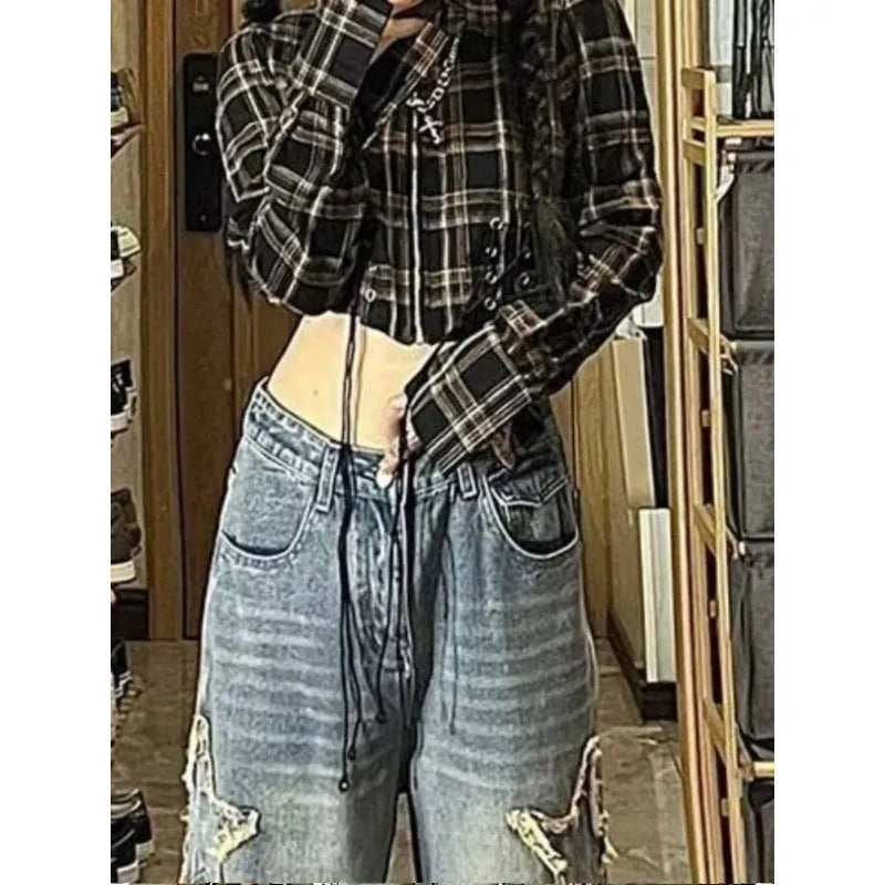 Blue high-waisted wide-leg denim jeans on a hanger showing straight-leg cut.