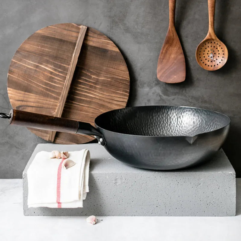 Traditional black iron wok pan with wooden handle measuring 40cm