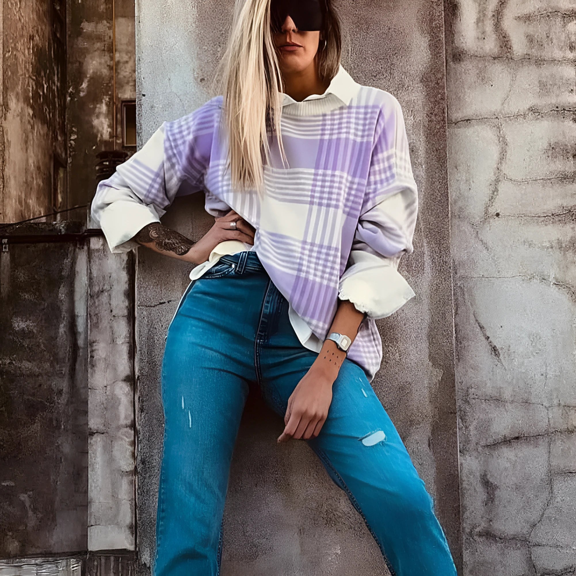 Lilac plaid print loose fit long sleeve sweater with ribbed trim on a hanger.