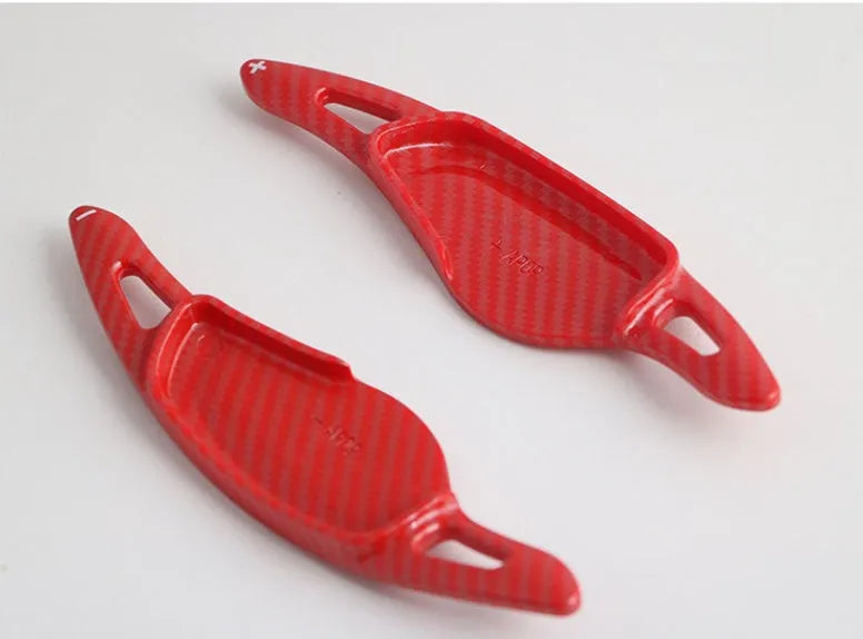 Carbon fibre steering wheel shift paddle in ABS plastic showing five colour finish options
