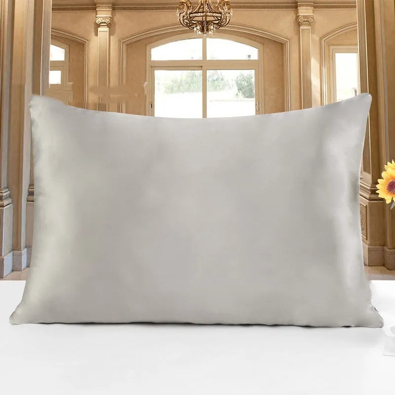 Double-sided silk pillowcase showing reversible design in apricot colour with three size options displayed