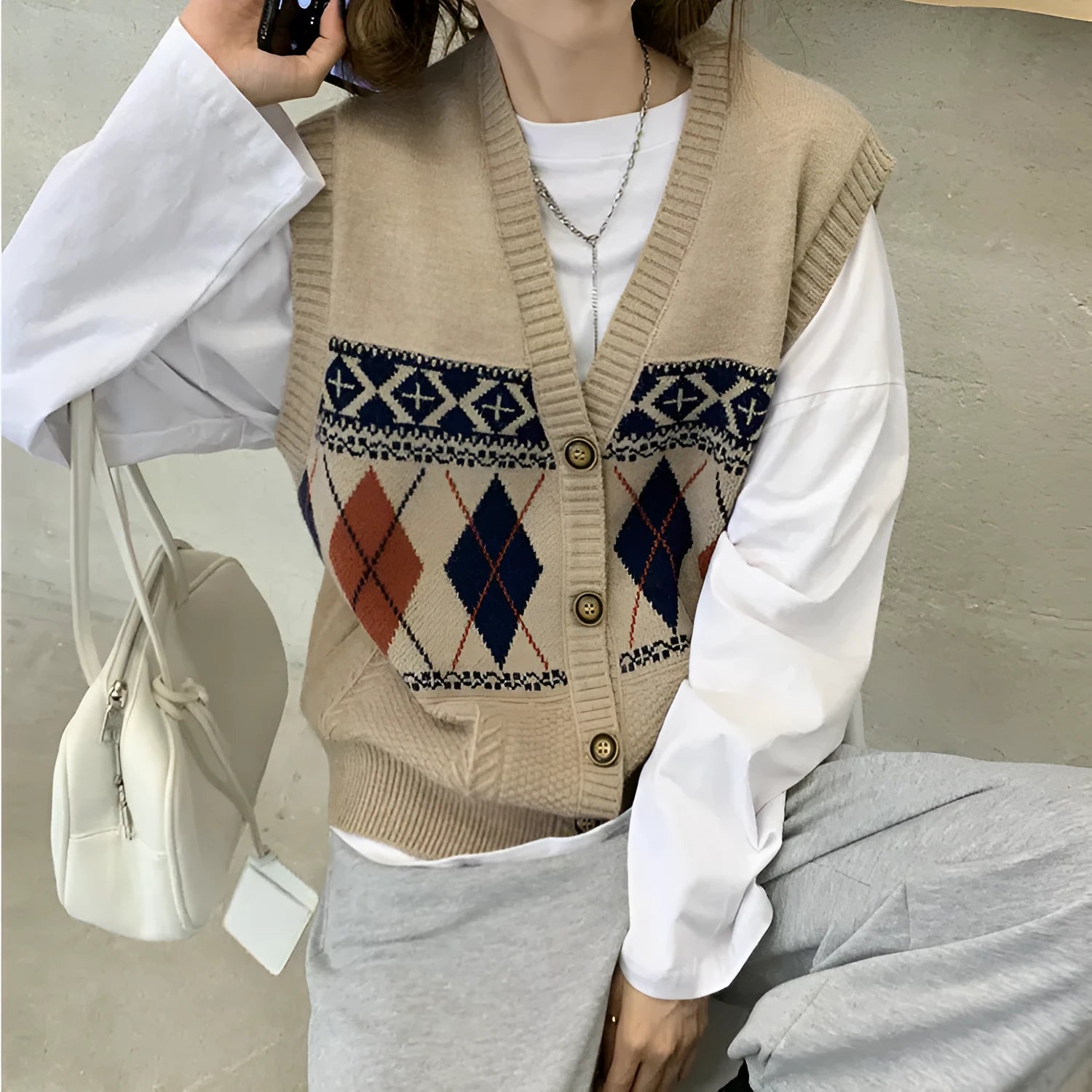 Diamond plaid sleeveless cardigan top in loose fit showing colour options