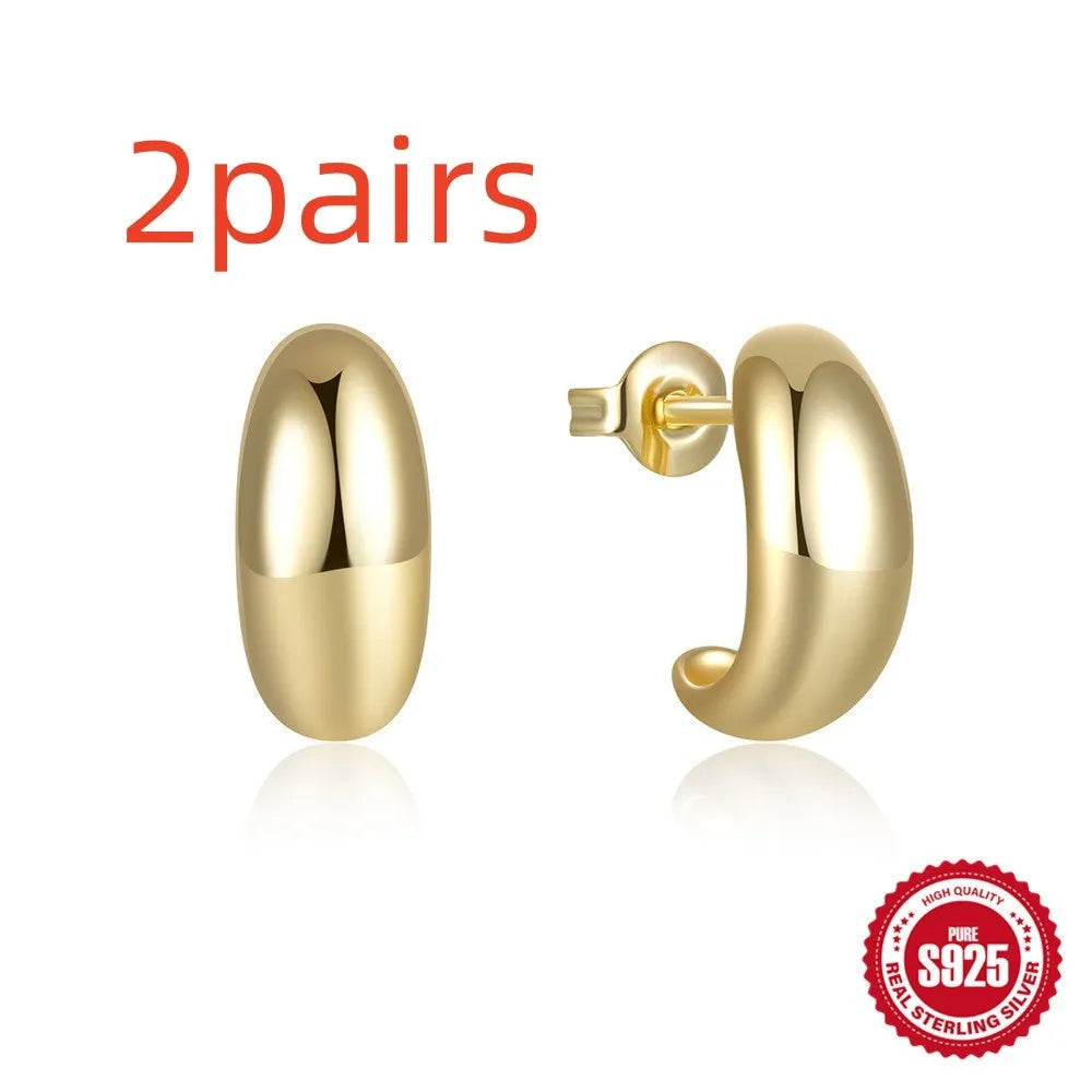Geometric C-shaped sterling silver stud earrings with gold electroplated finish