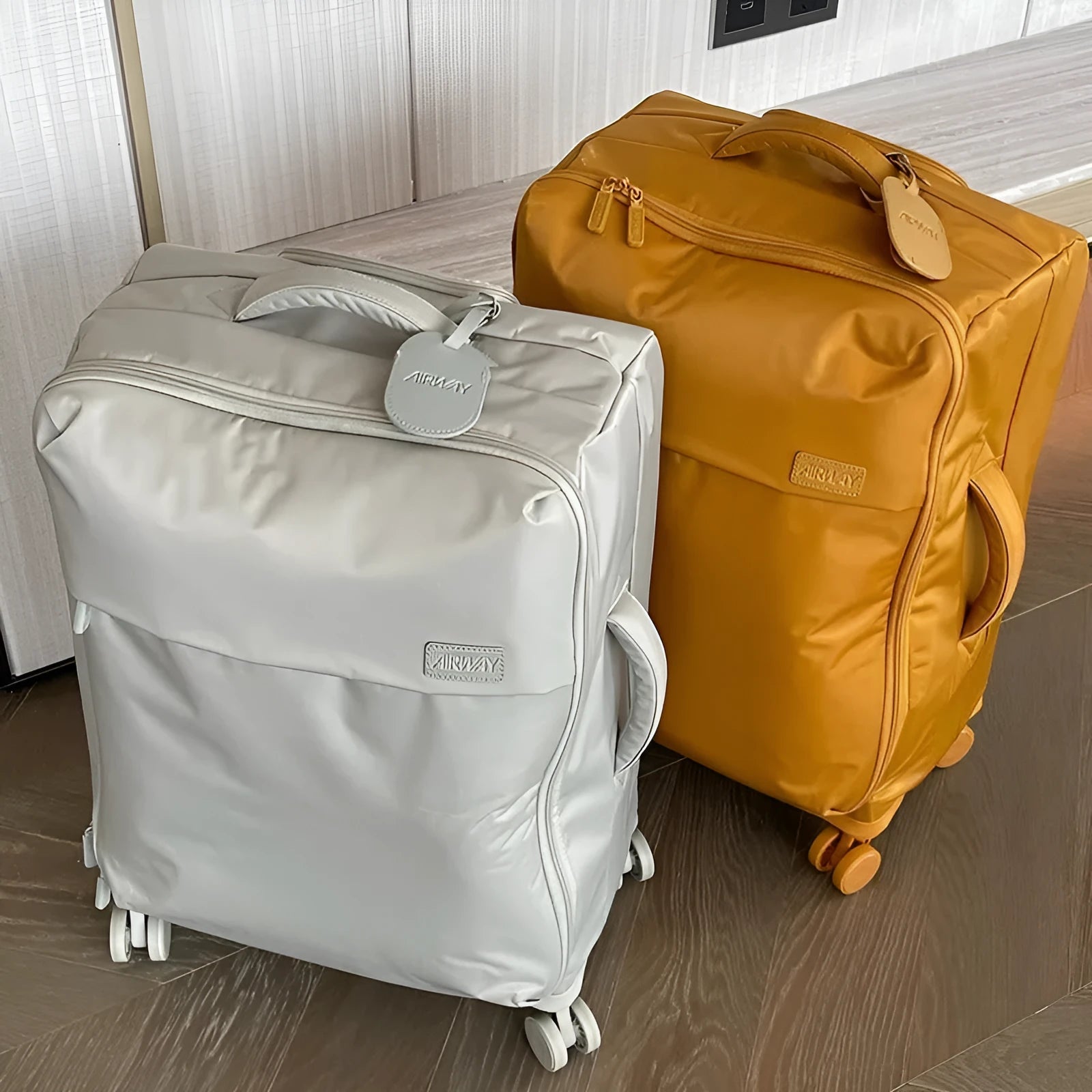 Ultra-light waterproof Oxford cloth suitcase with universal wheels in bluestone green colour.
