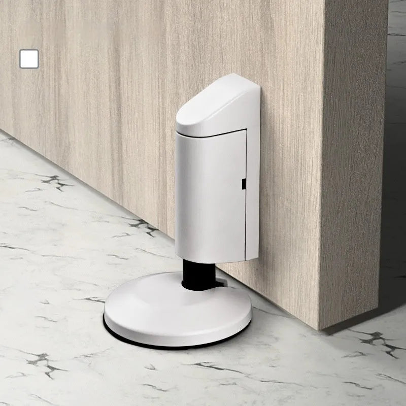 Modern invisible zinc alloy door stopper in six colour finishes on a wall.