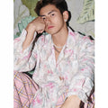 Embossed floral pattern shirt in chemical fibre blend fabric with loose fit and long sleeves