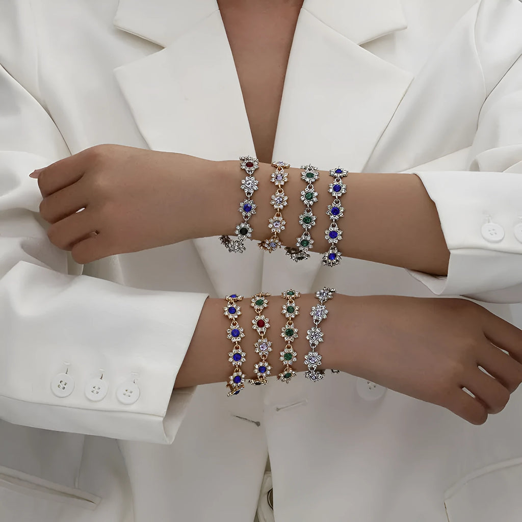 Electroplated zinc alloy bracelet with floral design in gold and silver colour variations