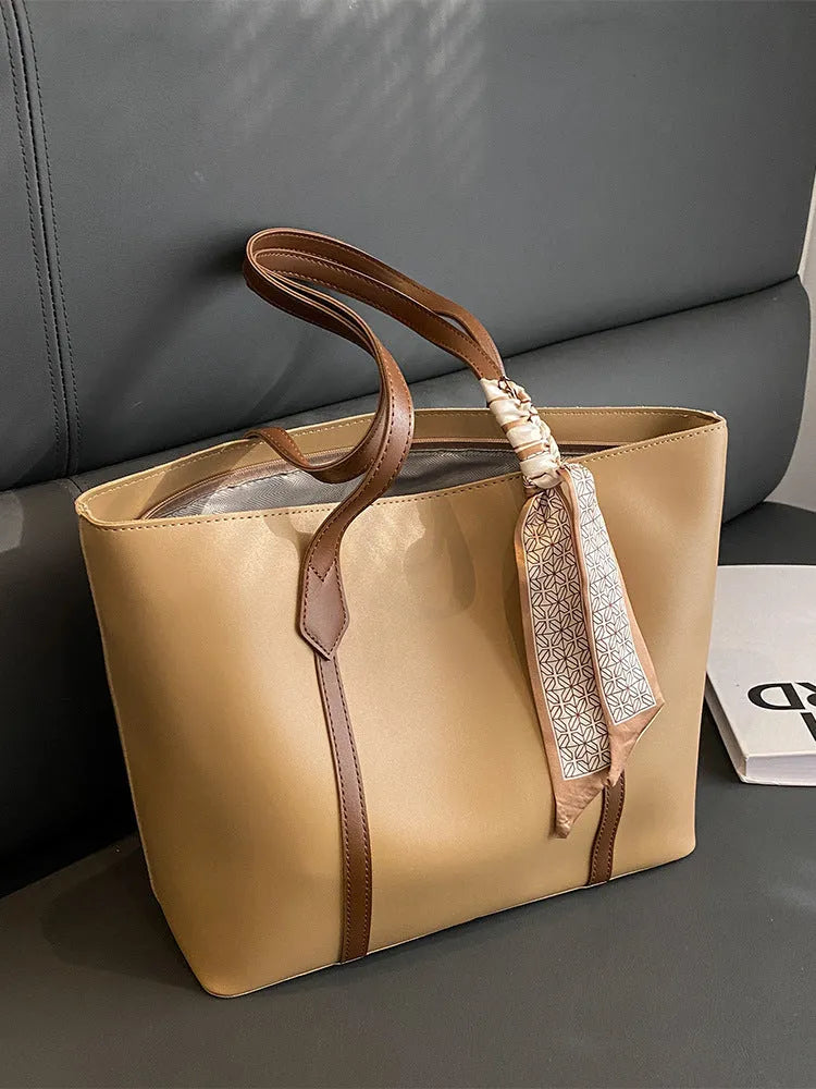 Large capacity bucket tote bag with soft construction and sandwich pocket design